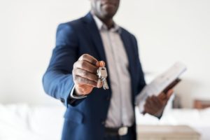 Real estate agent holding a key