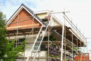 Scaffolding in the exterior of a house while a renovation takes place
